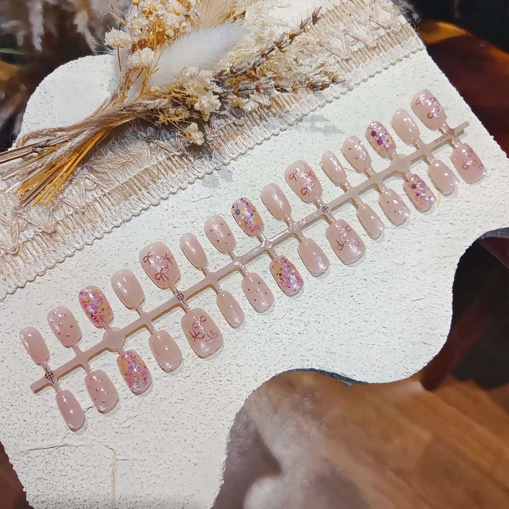Pink Butterfly Press-On Nails with Glitter and Bow Design